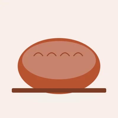 A round loaf with four scores across the crust, on a board