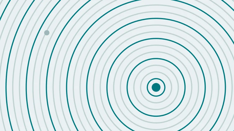 Concentric ripples spreading from a point low on the right