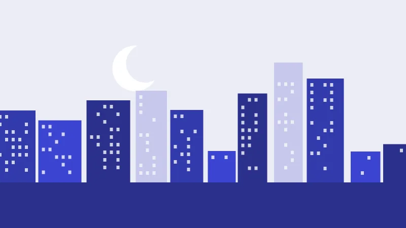 A city skyline at dusk, lit windows scattered across the blocks
