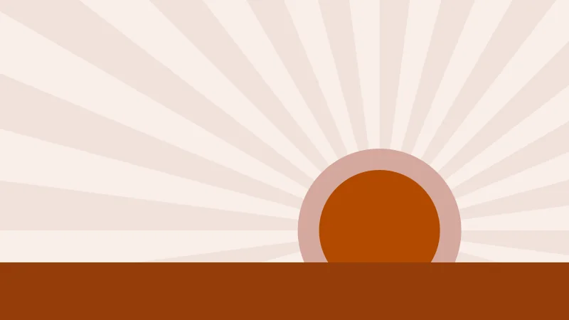 A low orange sun with rays fanning across the sky